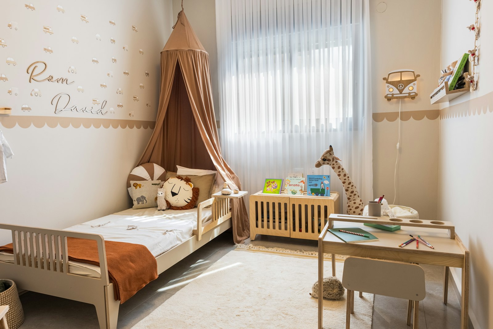 Cosy child's bedroom with a bed and a desk for play and homework